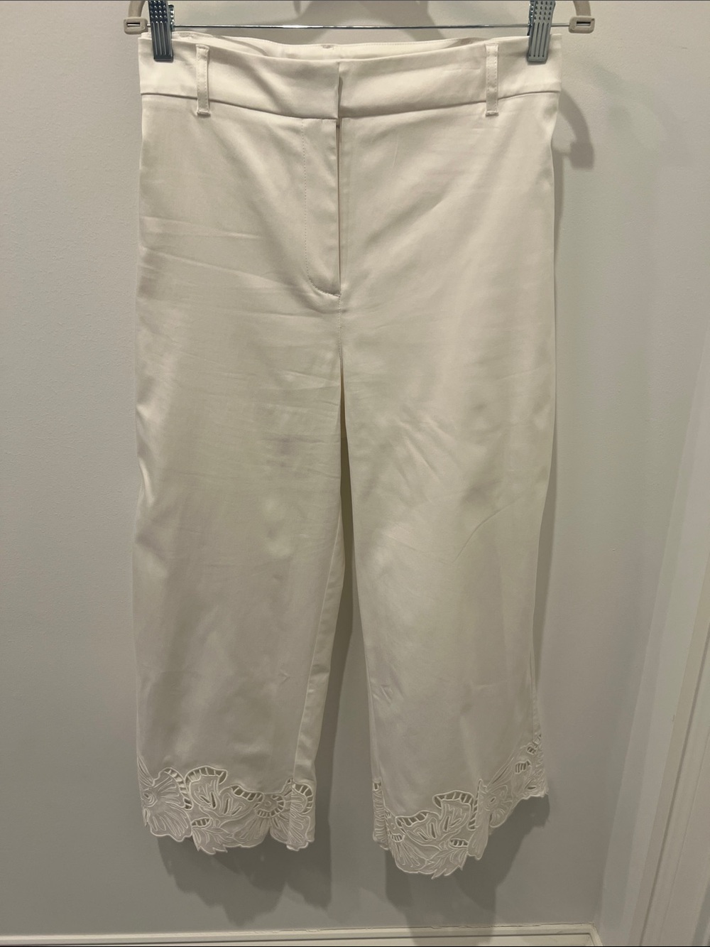 Chico's White Wide Legged Cropped Pants with Cut Out Detail at Bottom Hemline
